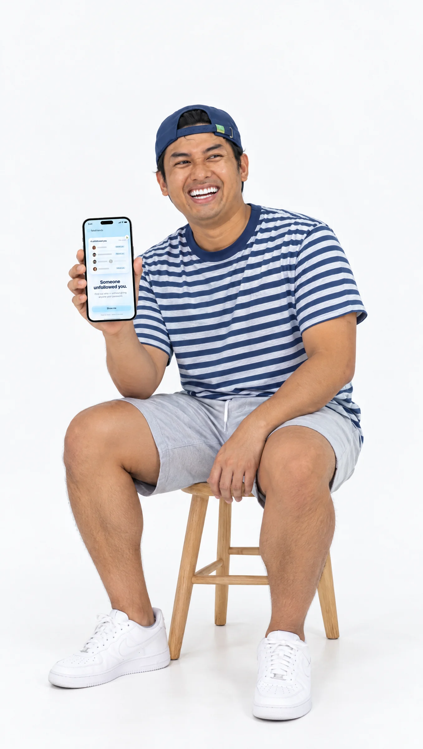 Fake Friends founder holding the app