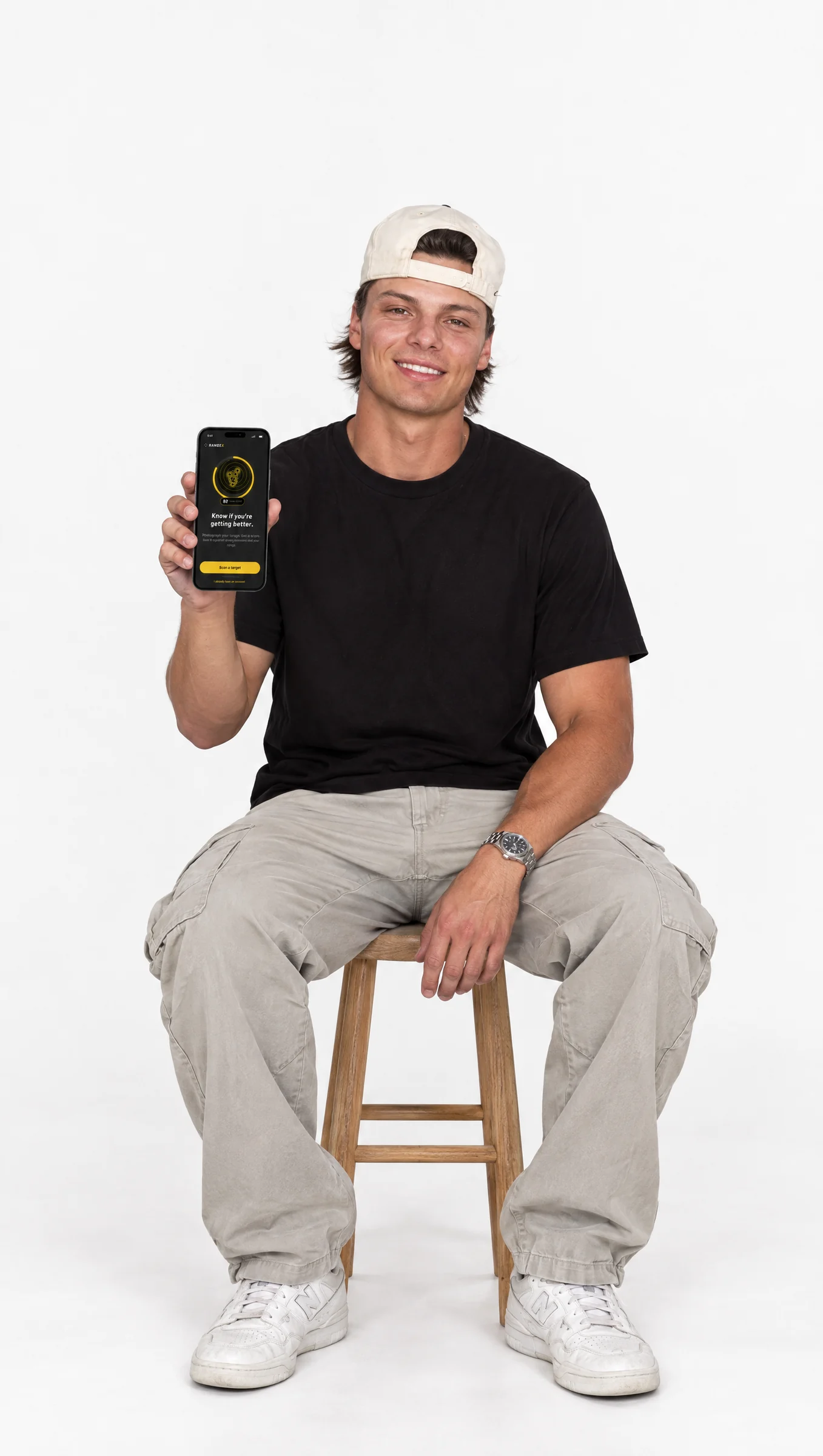 RangeX founder holding the app