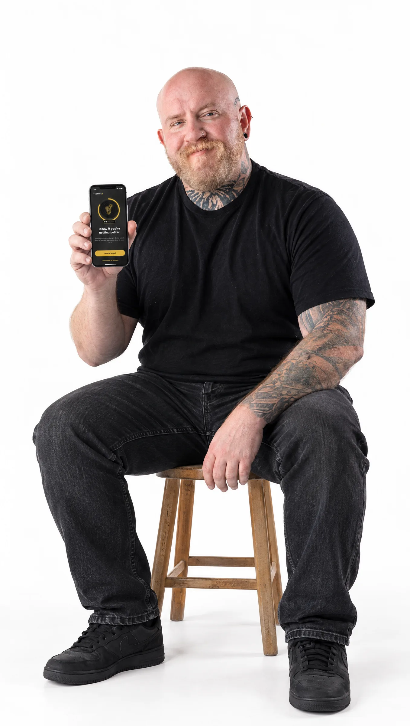 RangeX founder holding the app